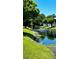 Peaceful view of the canal and lush landscaping at 6033 34Th W St # 1, Bradenton, FL 34210