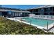Community swimming pool with surrounding landscaping at 6033 34Th W St # 1, Bradenton, FL 34210