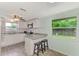 Renovated kitchen with granite counters and breakfast bar at 2900 Siesta Dr, Venice, FL 34293