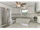 Updated kitchen with stainless steel appliances and granite counters at 2900 Siesta Dr, Venice, FL 34293