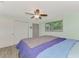 Main bedroom with king bed and ceiling fan at 2900 Siesta Dr, Venice, FL 34293