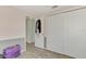 Bedroom with double closet and access to the hall at 2900 Siesta Dr, Venice, FL 34293
