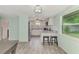 Modern kitchen with white cabinets and granite countertops at 2900 Siesta Dr, Venice, FL 34293