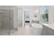 Spa-like bathroom with double vanity, a free-standing tub, and a large shower at 12444 Destin Loop, Venice, FL 34293