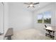 Spacious bedroom with neutral walls, a ceiling fan, and plenty of natural light at 12444 Destin Loop, Venice, FL 34293