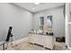 Bright home office features a large desk and plenty of natural light at 12444 Destin Loop, Venice, FL 34293