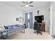 Cozy bedroom with a bed, gaming setup and large window at 12444 Destin Loop, Venice, FL 34293