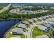 Waterfront property with a private pool and lush landscaping at 12444 Destin Loop, Venice, FL 34293