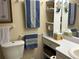 Bathroom with a toilet and double sinks at 461 Clover Rd, Venice, FL 34293