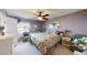Spacious bedroom with floral bedding and ceiling fan at 461 Clover Rd, Venice, FL 34293