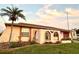 Ranch style home with landscaped yard and arched entryway at 461 Clover Rd, Venice, FL 34293