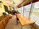 Spacious sunroom with large windows and table at 461 Clover Rd, Venice, FL 34293