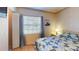 Bright bedroom with a double bed and window coverings at 461 Clover Rd, Venice, FL 34293