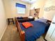 Cozy bedroom featuring twin beds and a window at 461 Clover Rd, Venice, FL 34293
