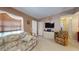 Living room with a sofa, recliner, and a large TV at 461 Clover Rd, Venice, FL 34293