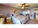 Bright bedroom with floral bedding and ceiling fan at 461 Clover Rd, Venice, FL 34293