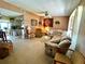 Spacious living room with ample seating and views to kitchen at 461 Clover Rd, Venice, FL 34293