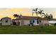 Spacious backyard with shed and patio area, perfect for outdoor entertaining at 461 Clover Rd, Venice, FL 34293
