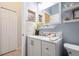 Modern bathroom with white vanity, tiled walls, and a large mirror at 342 Wyler St, Port Charlotte, FL 33954