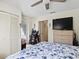 Bedroom with a queen bed, built-in closets, and a TV at 6101 34Th W St # 16A, Bradenton, FL 34210