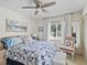 Bright bedroom with a queen-size bed and a ceiling fan at 6101 34Th W St # 16A, Bradenton, FL 34210