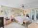 Spacious bedroom with a queen bed, access to a private patio, and plenty of natural light at 6101 34Th W St # 16A, Bradenton, FL 34210