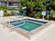 Inviting community spa with seating and safety rails at 6101 34Th W St # 16A, Bradenton, FL 34210
