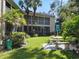 Landscaped backyard with stone patio set and umbrella at 6101 34Th W St # 16A, Bradenton, FL 34210