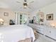 Main bedroom with a queen bed, dresser, and access to a private patio at 6101 34Th W St # 16A, Bradenton, FL 34210