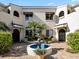 Spanish style building with courtyard fountain and lush landscaping at 6101 34Th W St # 16A, Bradenton, FL 34210