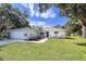 Single story home with large yard and oak tree at 3800 Davis Blvd, Sarasota, FL 34232