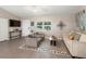 Cozy living room with comfortable seating and a large TV at 3800 Davis Blvd, Sarasota, FL 34232