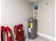Interior garage view, showing water heater and storage at 3800 Davis Blvd, Sarasota, FL 34232