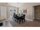 Bright dining room with six-chair table and access to the backyard at 3800 Davis Blvd, Sarasota, FL 34232