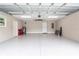 Spacious two-car garage with epoxy flooring and ample storage at 3800 Davis Blvd, Sarasota, FL 34232