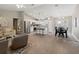 Open concept living area, kitchen, and dining area with wood-look floors at 3800 Davis Blvd, Sarasota, FL 34232