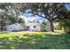 Single story home with large yard and oak tree at 3800 Davis Blvd, Sarasota, FL 34232