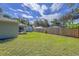 Large backyard with wooden fence and shed at 3800 Davis Blvd, Sarasota, FL 34232