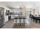 Modern kitchen with white cabinets, stainless steel appliances, and island at 3800 Davis Blvd, Sarasota, FL 34232