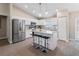 Modern kitchen featuring stainless steel appliances and an island with seating at 3800 Davis Blvd, Sarasota, FL 34232