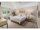 Spacious main bedroom with a king-size bed and private access to the bathroom at 3800 Davis Blvd, Sarasota, FL 34232