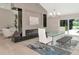 Dining area with modern table and chairs, elegant chandelier, and fireplace feature at 2850 Desoto Rd, Sarasota, FL 34234