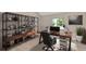 Home office area with modern furnishings, stylish shelving, and a large wooden desk at 2850 Desoto Rd, Sarasota, FL 34234