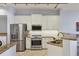 Modern kitchen with stainless steel appliances and granite countertops at 2715 Terra Ceia Bay Blvd # 702, Palmetto, FL 34221