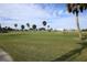 Driving range with lush green grass and palm trees at 2715 Terra Ceia Bay Blvd # 702, Palmetto, FL 34221