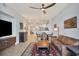 Spacious living room with leather sofas and a view into the dining area at 2715 Terra Ceia Bay Blvd # 702, Palmetto, FL 34221