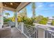 Private balcony overlooking lush tropical landscape at 316 Spring Ave, Anna Maria, FL 34216