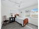 Bright bedroom with wood bed frame and window blinds at 247 Barlow Ave # 28, Sarasota, FL 34232