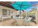 Private patio with seating area and grill at 3124 Windrush Bourne # 10, Sarasota, FL 34235