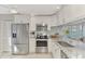 Modern kitchen with stainless steel appliances and granite countertops at 3124 Windrush Bourne # 10, Sarasota, FL 34235